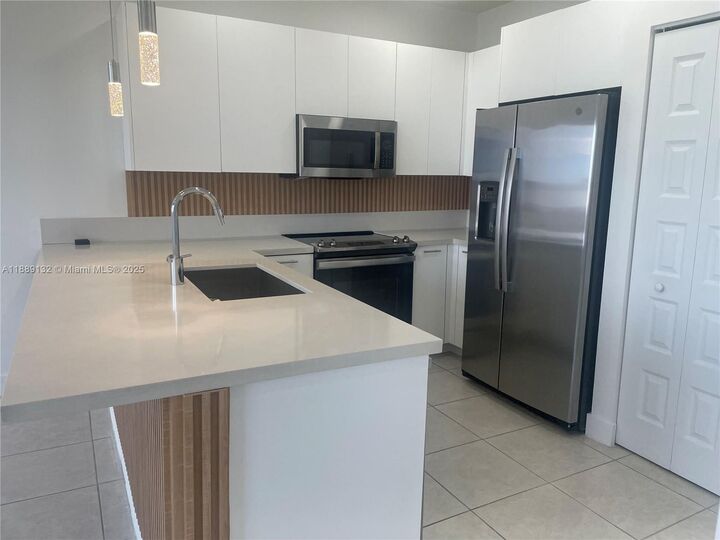 Property Photo:  6455 NW 103rd Pl 304  FL 33178 