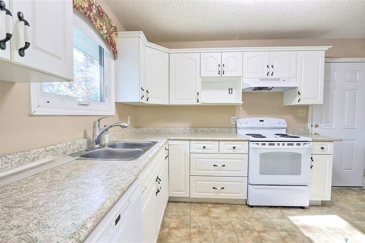 Property Photo:  165 Macdowall Crescent  SK S6V 6N4 