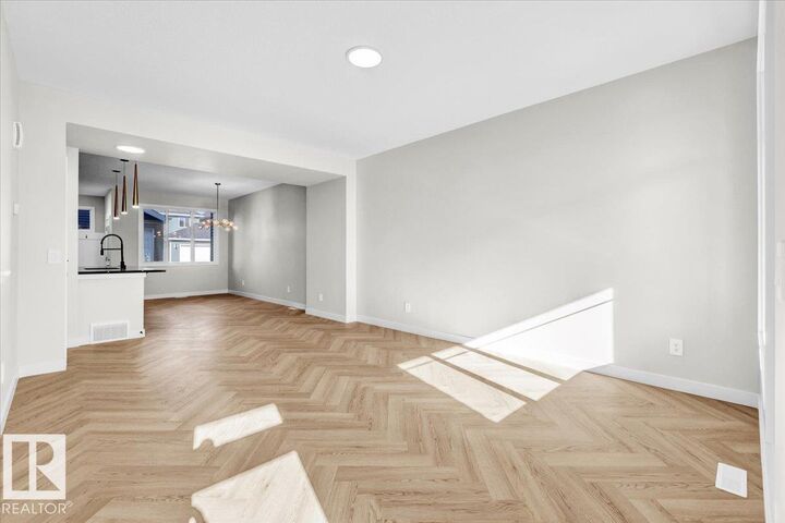 Property Photo: 1328 Keswick Drive SW AB T6W 4V8