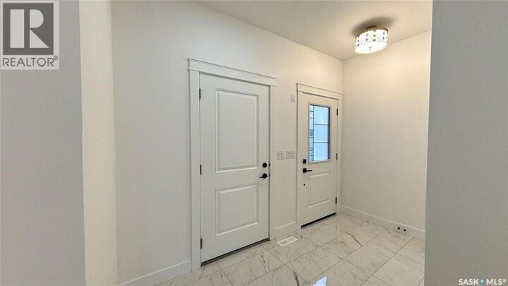 Property Photo:  147 Woolf Bend  SK S7W 0L6