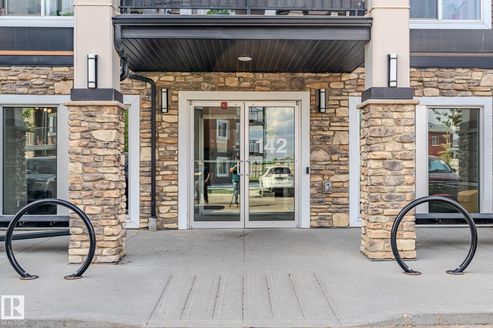 Property Photo: 142 Ebbers Boulevard NW 107 AB T5Y 3W2