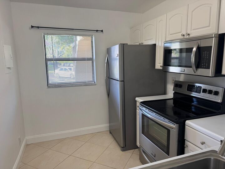 Property Photo:  6772 Palmetto Circle S 104  FL 33433 
