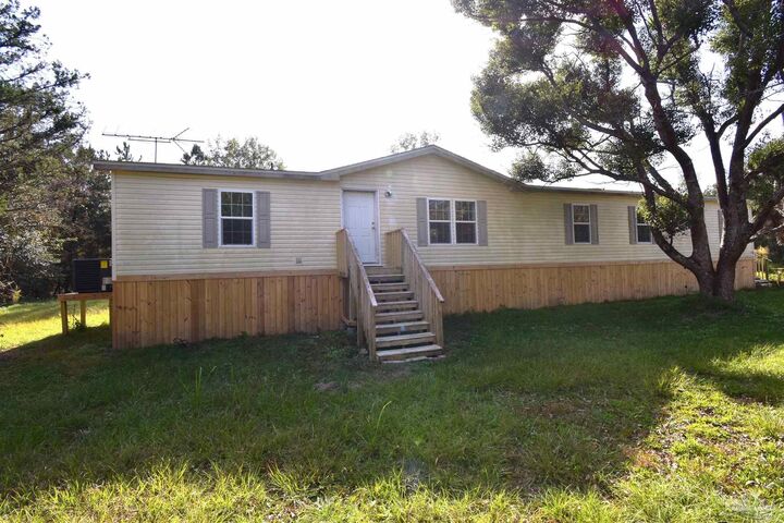 Property Photo: 7973 Malone Rd FL 32570