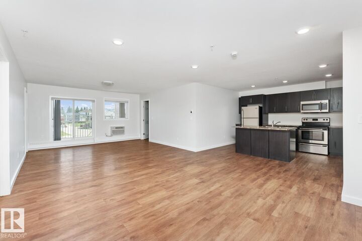 Property Photo:  1601 8 Avenue 1103  AB T9M 0C3 