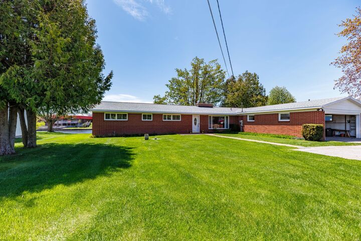 Property Photo:  190 Riverside Drive  MI 49721 