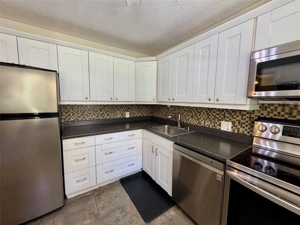 Property Photo:  2601 S Course Drive 305  FL 33069 