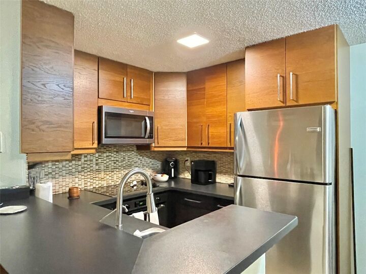 Property Photo:  851 Lyons Road 22106  FL 33063 