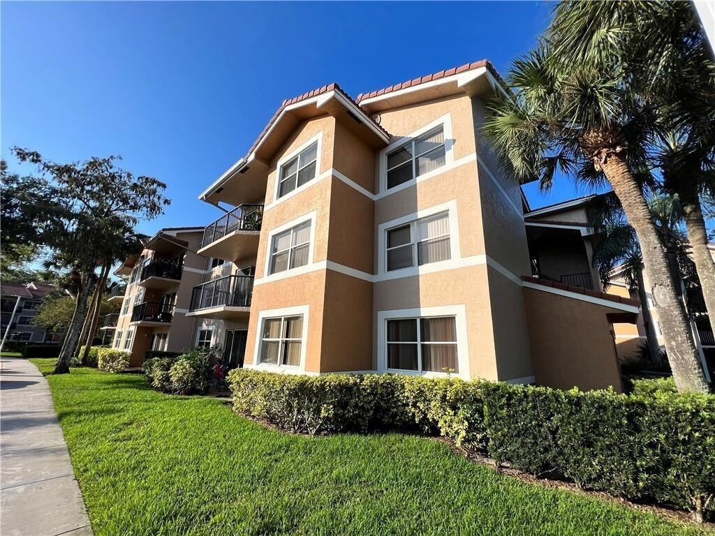 Property Photo:  9055 Wiles Road 108  FL 33067 