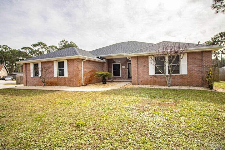 Property Photo:  6977 Leisure St  FL 32566 