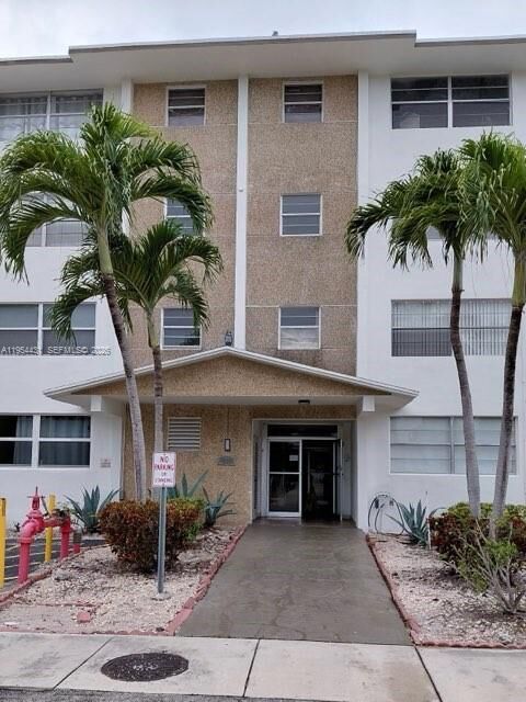 Property Photo:  211 NE 8th Ave 108  FL 33009 