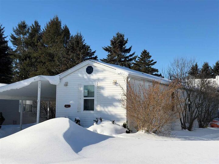 Property Photo:  6685 M-66 North #51  MI 49720 