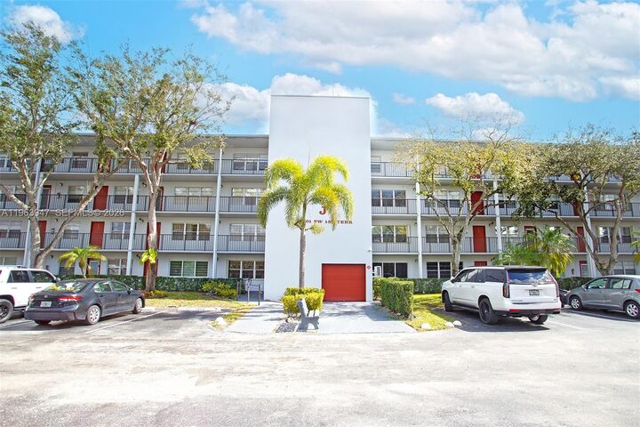 Property Photo:  1301 SW 135th Ter 413J  FL 33027 