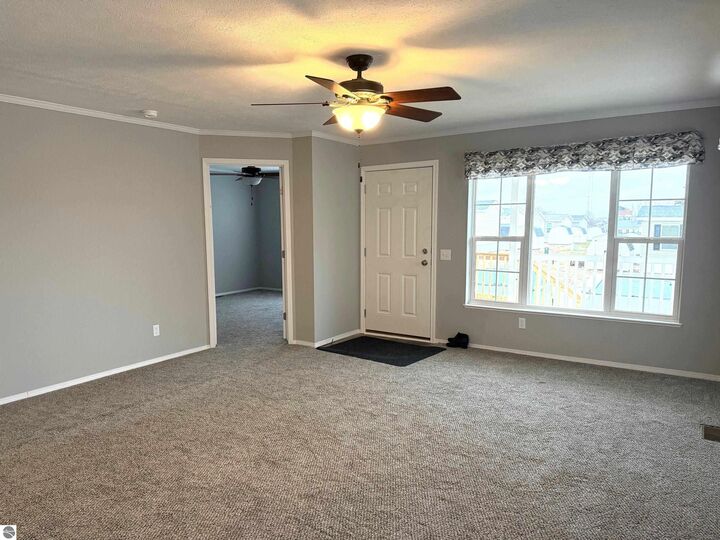 Property Photo:  1211 Wellington Drive  MI 48858 