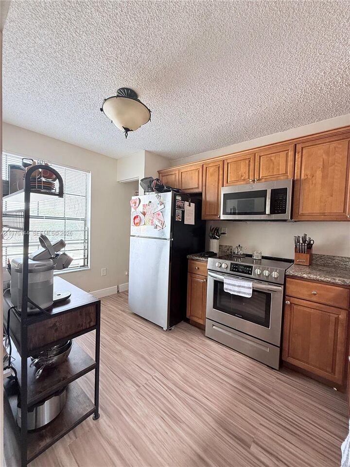 Property Photo:  12906 SW 88th Ter B-202  FL 33186 