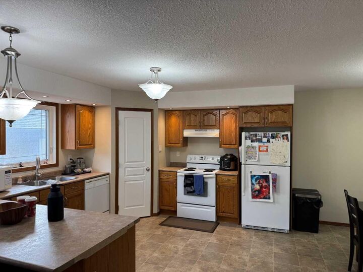 Property Photo:  2608B 11 Avenue  AB T9W 1W2 