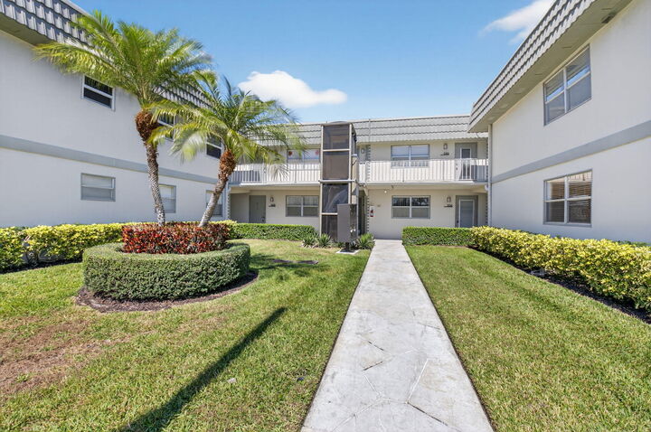 Property Photo:  205 Flanders E  FL 33484 