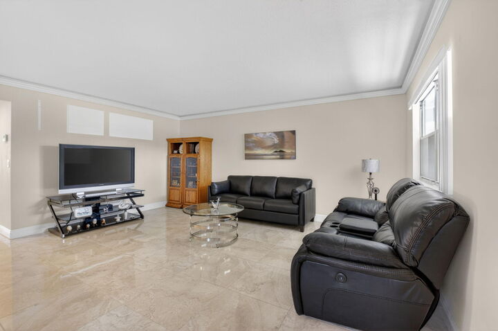 Property Photo:  205 Flanders E  FL 33484 