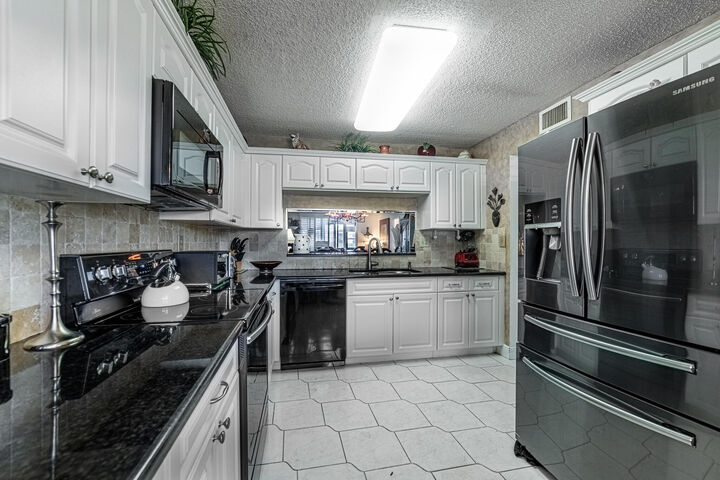 Property Photo:  15456 Pembridge Drive 111  FL 33484 