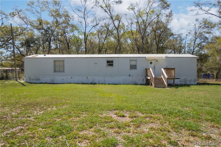 Property Photo:  5590 NW 76th Avenue  FL 32626 