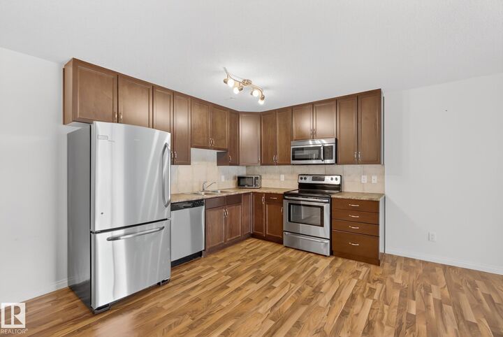Property Photo: 1204 156 Street NW 216 AB T6R 0R6
