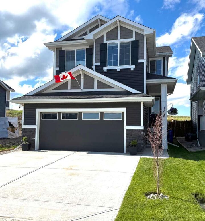 Property Photo: 163 Sundown Crescent AB T4C 2A6