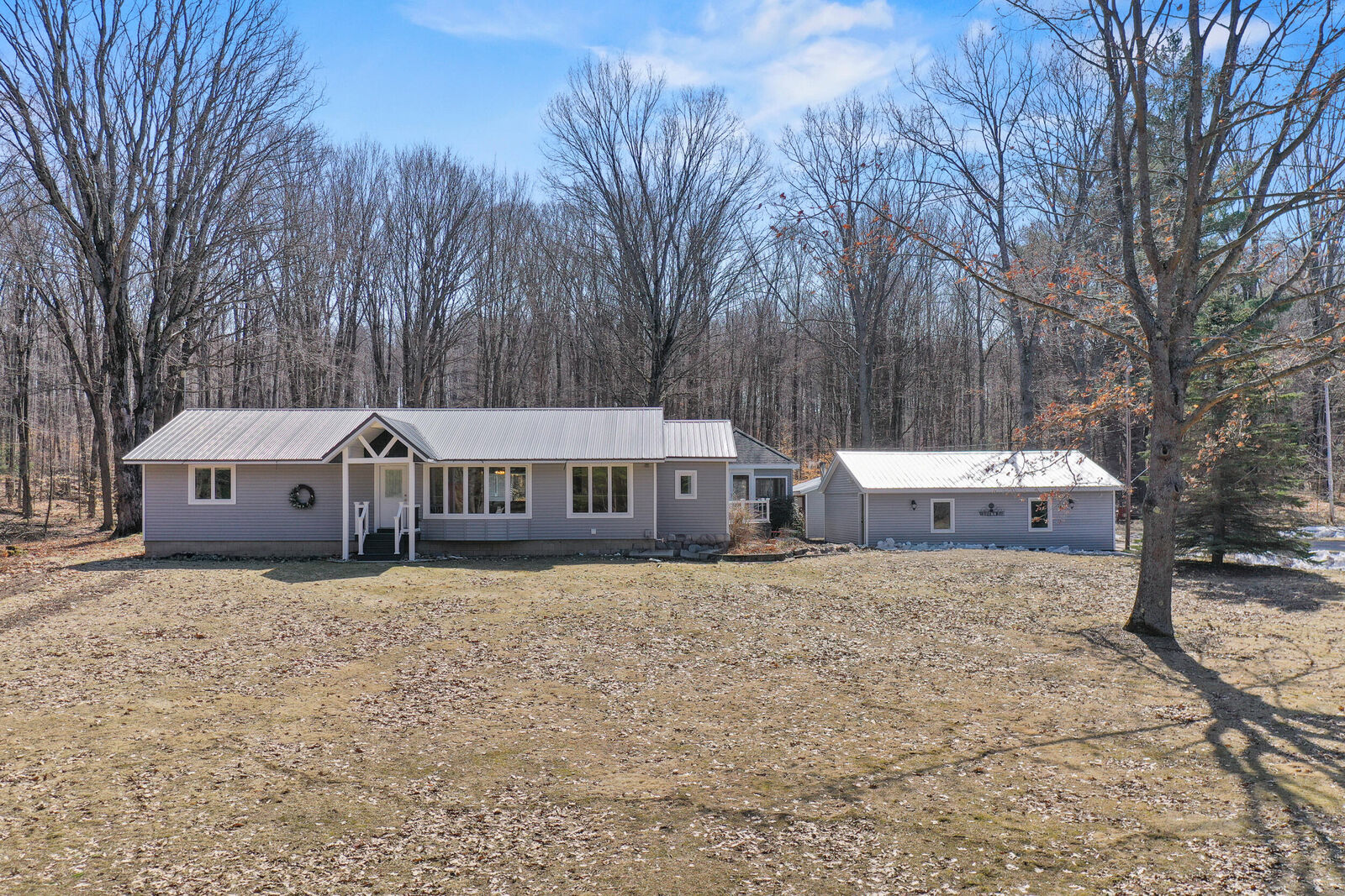 Property Photo:  10319 E 4 1/2 Mile Road  MI 49656 