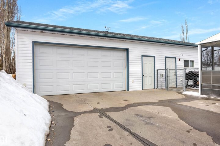 Property Photo:  9028 95 Avenue  AB T8L 1C6 