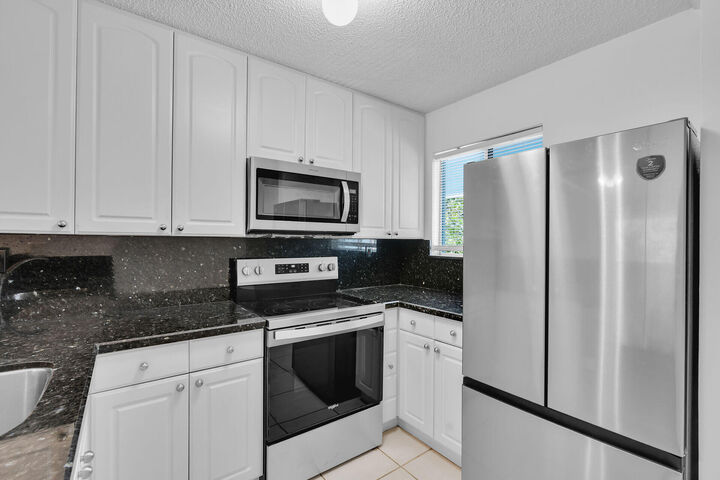 Property Photo:  98402 Windward Avenue 98402  FL 33037 