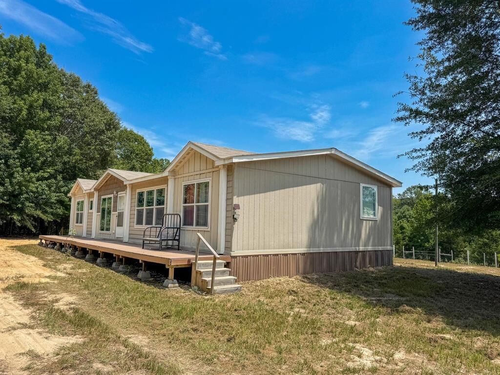 Property Photo:  301 County Road 1764   75563 