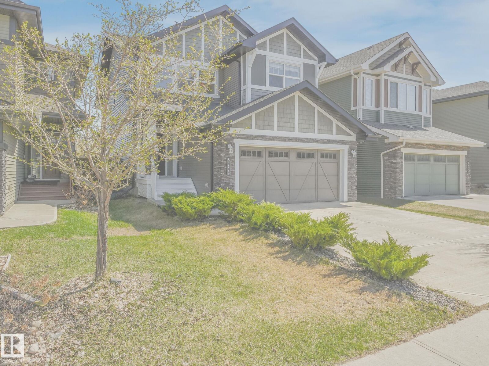 Property Photo:  8427 216 Street NW  AB T5T 4W2 