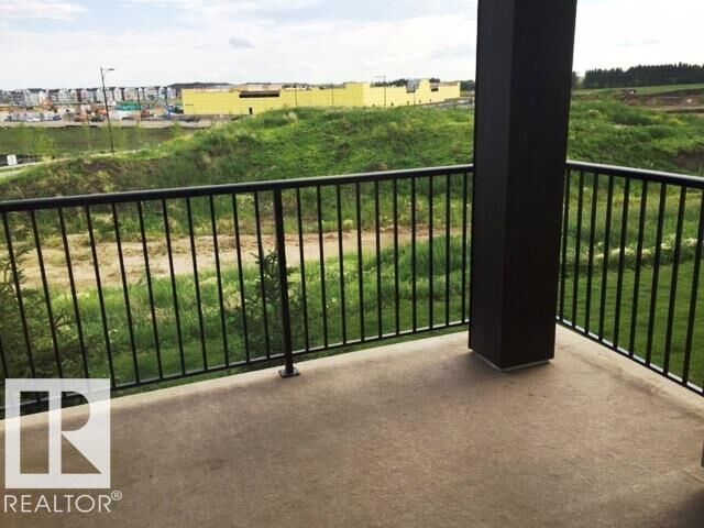 Property Photo:  12035 22 Avenue SW 206  AB T6W 2X9 