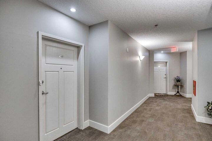Property Photo:  77 George Fox Trail W 213  AB T4C 0N1 