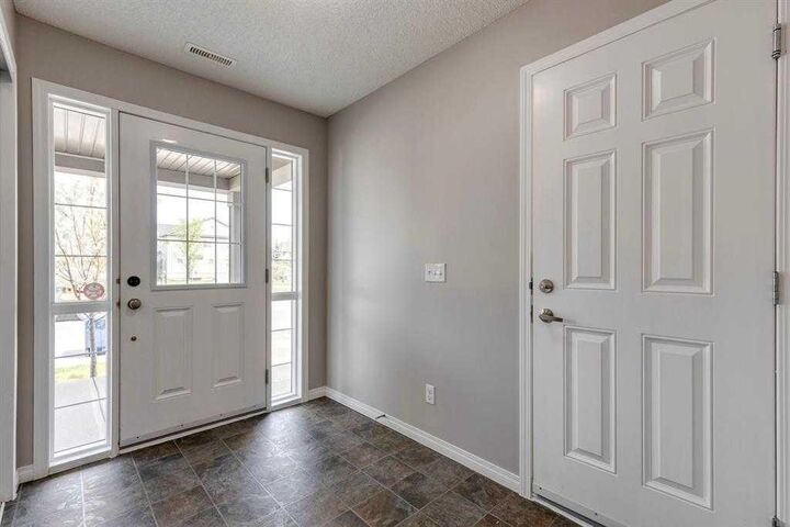 Property Photo:  113 Windstone Avenue SW  AB T4B 3R3 