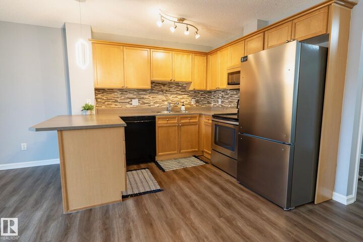 Property Photo: 4407 23 Street NW 404 AB T6T 0B6