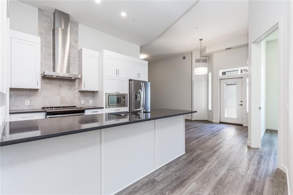 Property Photo:  12 Mahogany Path SE 109  AB T3M 3A4 