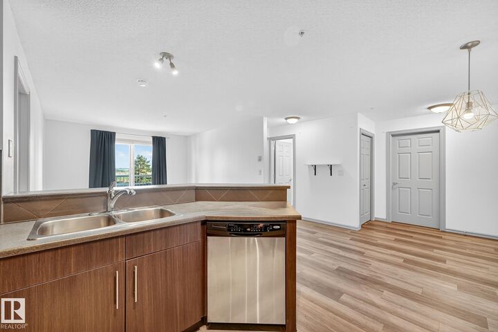 Property Photo:  2208 44 Avenue NW 215  AB T6T 0G6 
