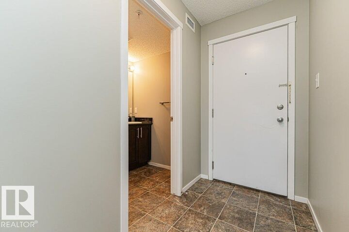 Property Photo:  18126 77 Street NW 305  AB T5Z 0N7 