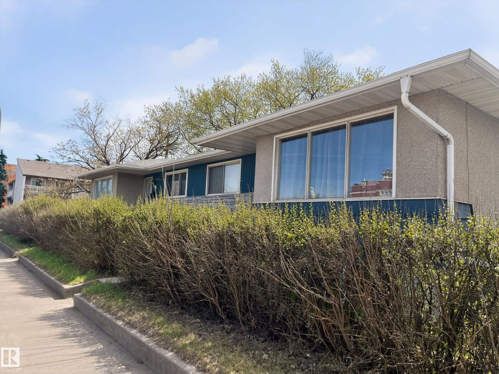 Property Photo:  13007 / 13009 111 Avenue NW  AB T5M 2N8 