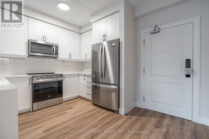 Property Photo:  6415 Regional Road 25 201  ON L9T 8R2 