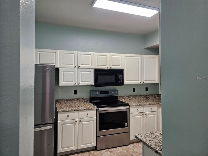 Property Photo:  5506 Metrowest Boulevard 13-103  FL 32811 