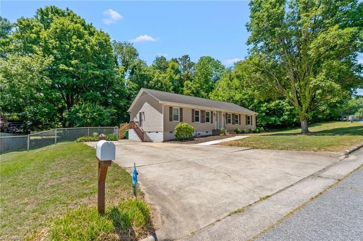 Property Photo:  1800 Rivertrace Point  NC 27265 