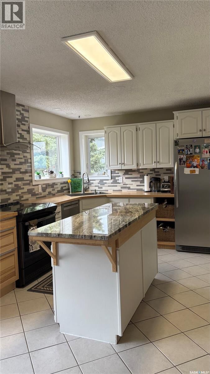 Property Photo:  303 Currie Crescent  SK S0G 4V0 