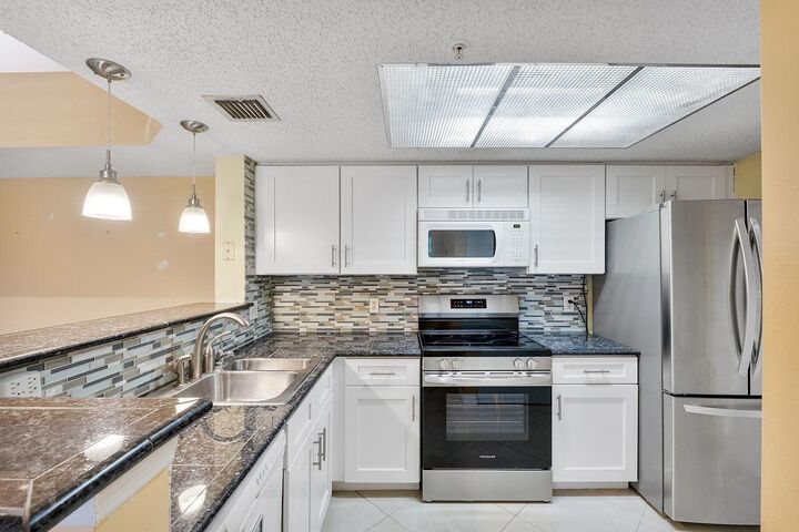 Property Photo: 5011 Wiles Road 303 FL 33073
