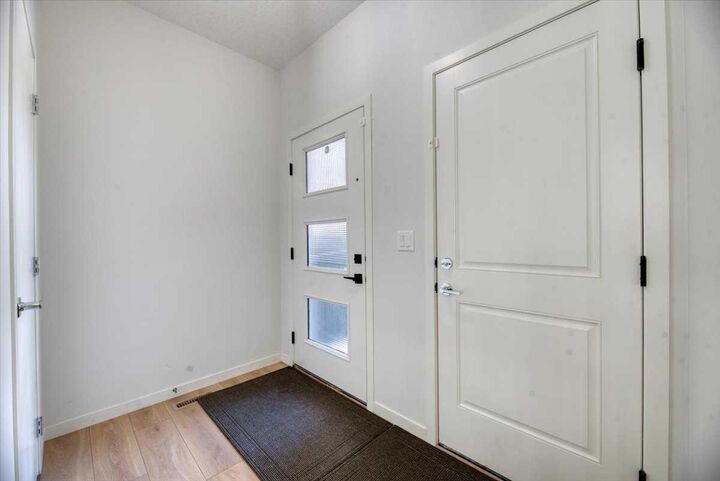 Property Photo:  125 Belmont Villas SW  AB T2X 4N5 