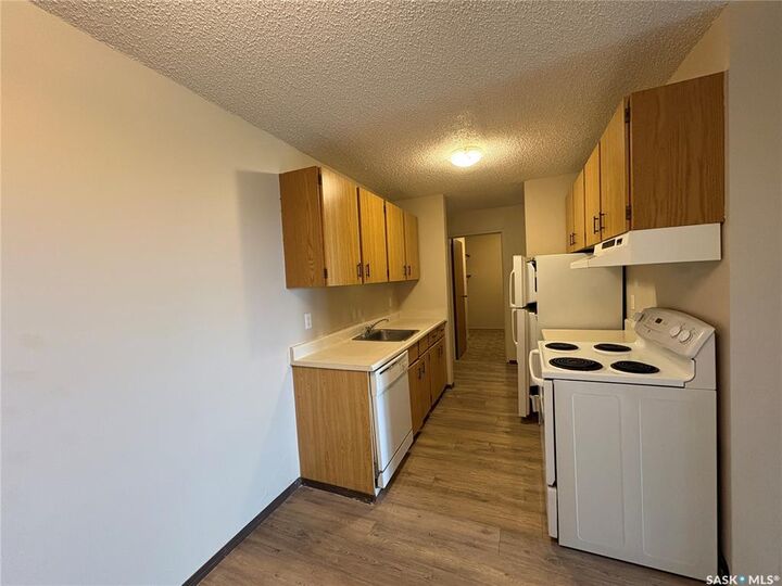Property Photo: 1140 9th Avenue NE 303 SK S9H 2S9