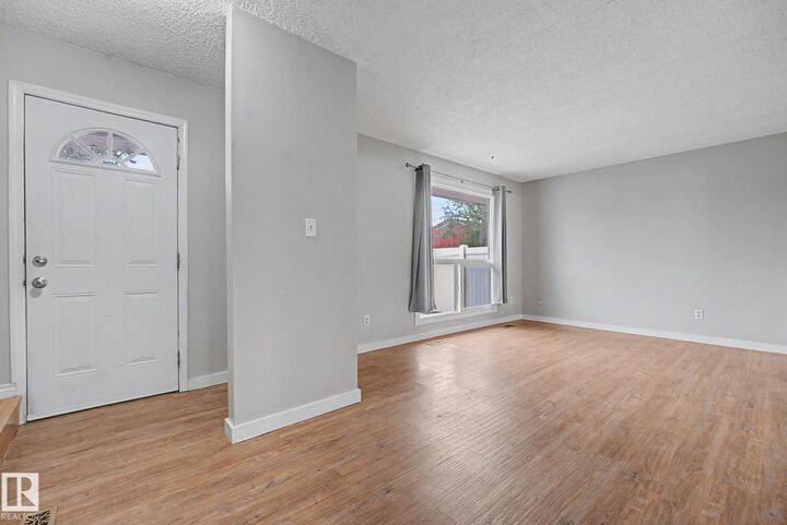 Property Photo:  13303 47 Street NW  AB T5A 3L5 