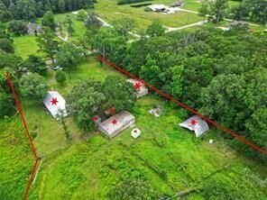 Property Photo: 1083 County Road 3141 TX 77327
