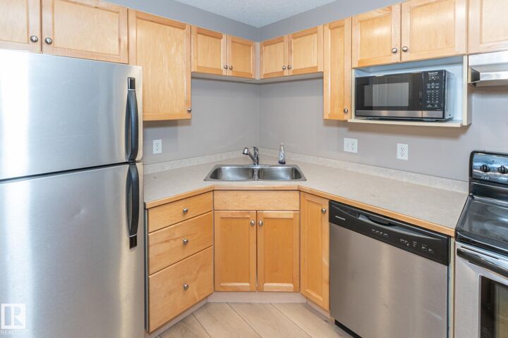 Property Photo: 245 Edwards Drive SW 119 AB T6X 1J9