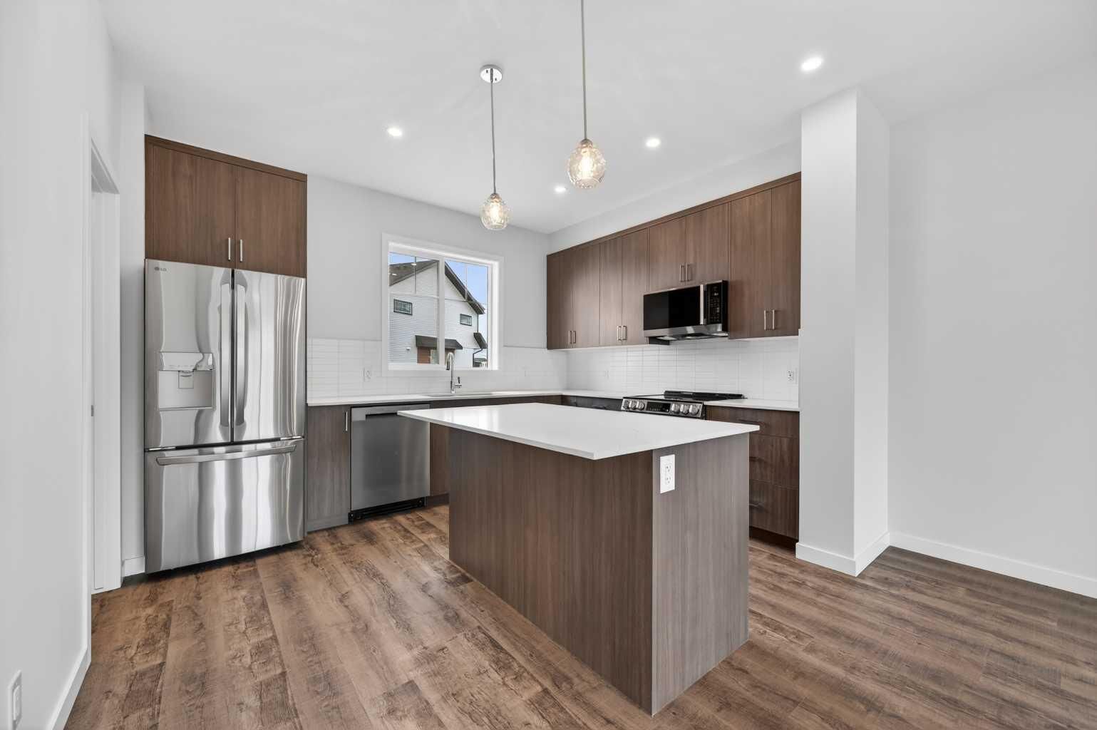 Property Photo: 28 Red Embers Plaza NE 203 AB T3N 2W1