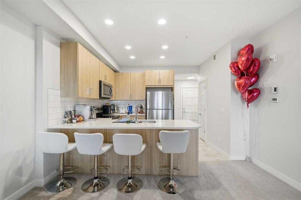 Property Photo:  55 Wolf Hollow Crescent SE 318  AB T2X 5K9 
